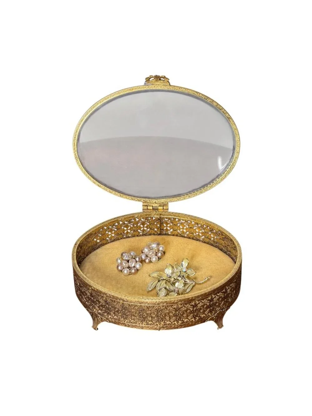 Vintage Hollywood Regency style brass filigree jewelry box with beveled glass to